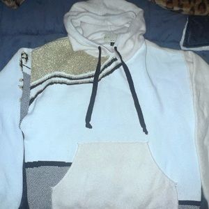 Giu Giu cream sweater with gold and black.